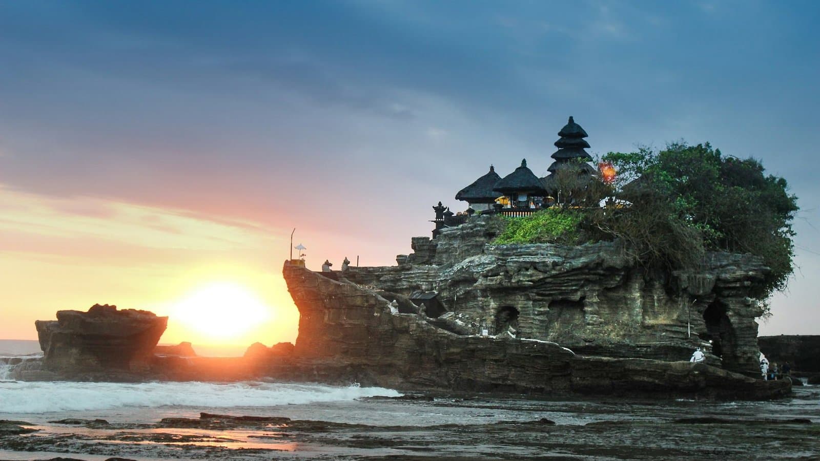 Traditional Balinese temple gate framed by tropical forest